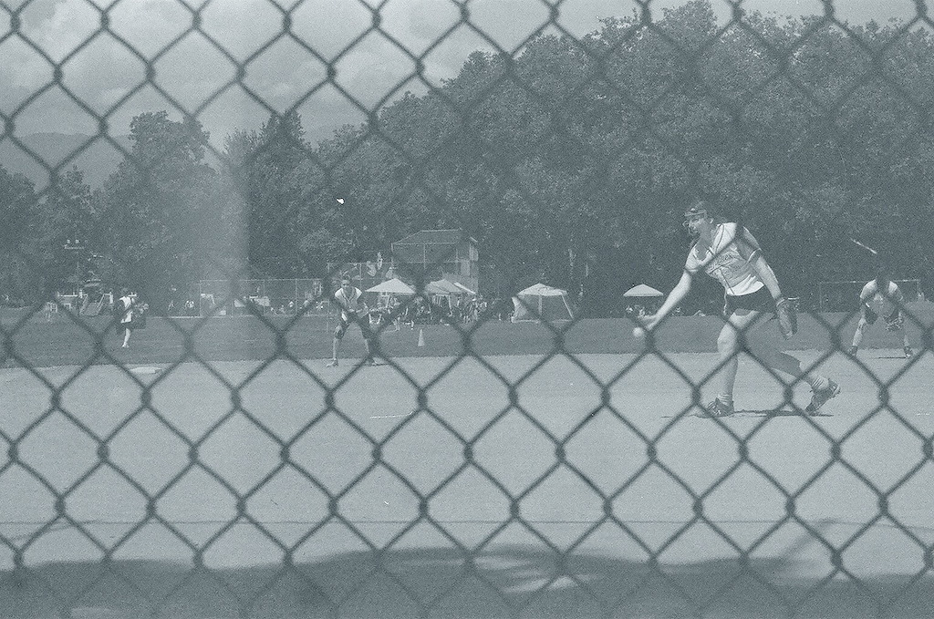 Teammate pitching the ball.